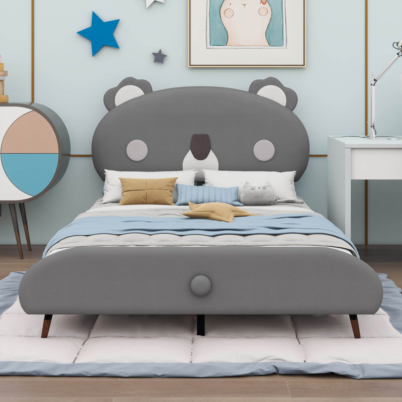 A Full Upholstered Platform Bed With A Koala Shaped Headboard